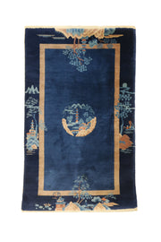 Antique Chinese Art Deco rug, 60x35 inches (152x88 cm), featuring a central circular motif on a dark navy background with whimsical landscape elements, hand-knotted in blue and beige wool with geometric design.
